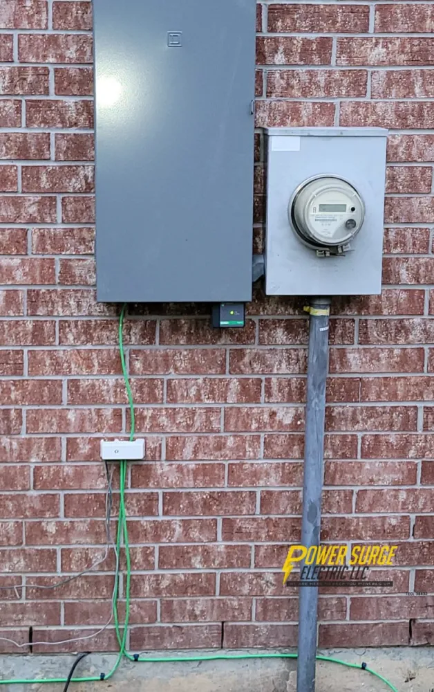 Completed Square D outdoor panel beside the meter on a red brick home.